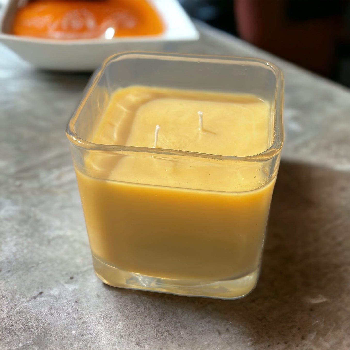 Creme Brulee Triple Scented Candle, caramel colored candle, picture of creme brulee dessert in background